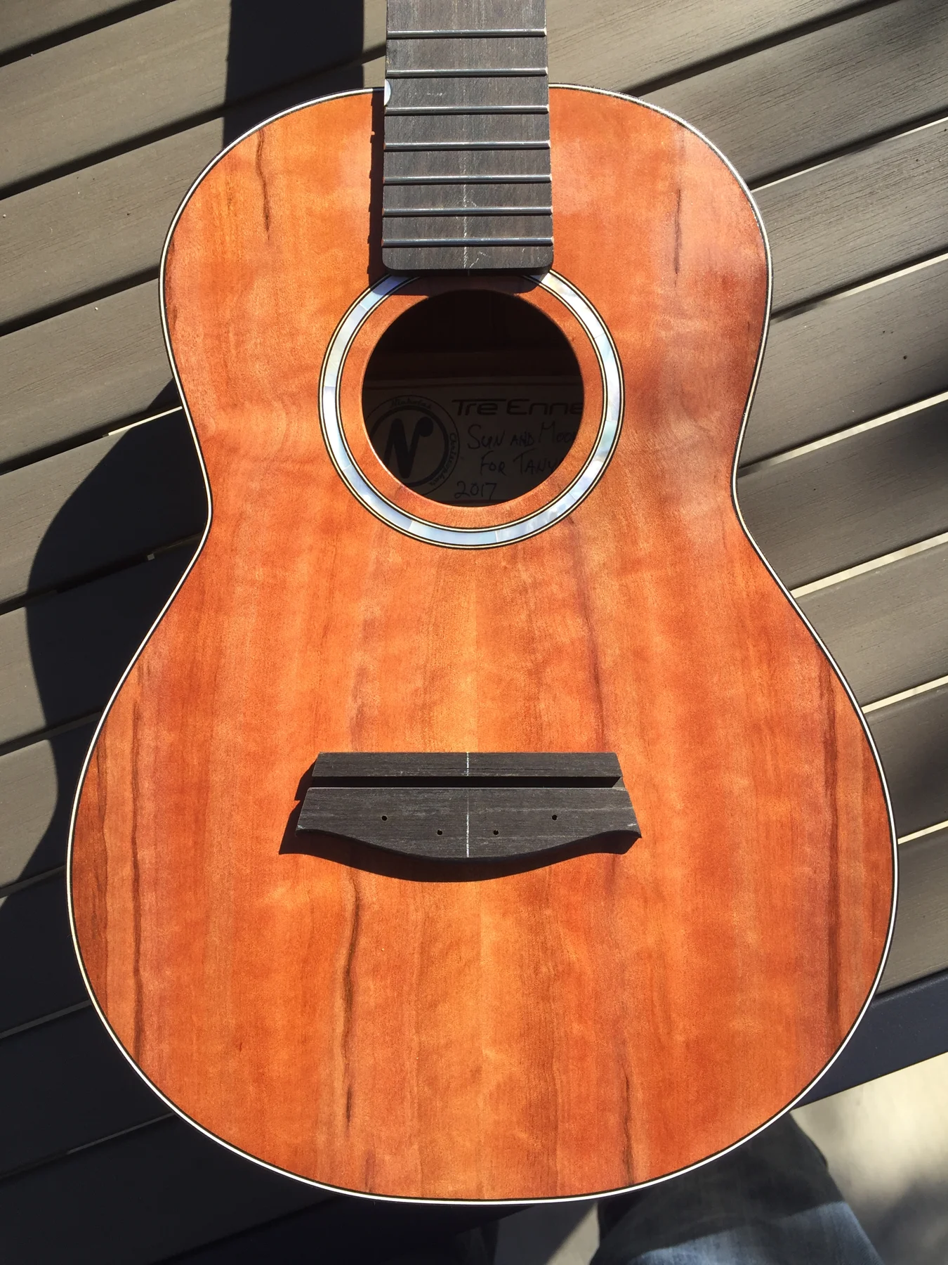 Wooden ukulele in sunlight